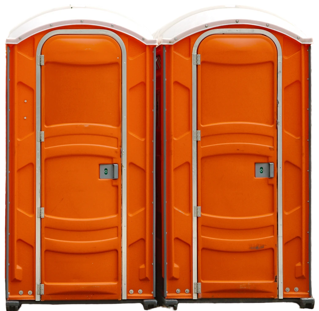 Bright orange portable restrooms outdoors